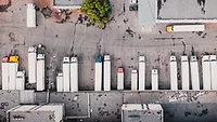 aerial view of cargo trucks at loading docks aerial view of cargo trucks at loading docks