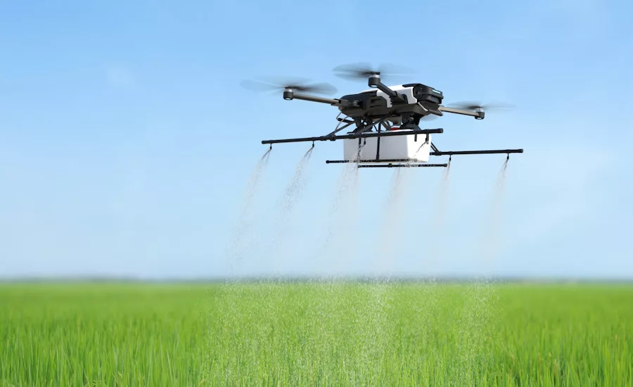 Drone spraying chemicals on a field
