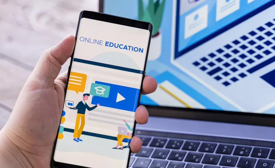 Image of someone engaging in online education on their laptop computer