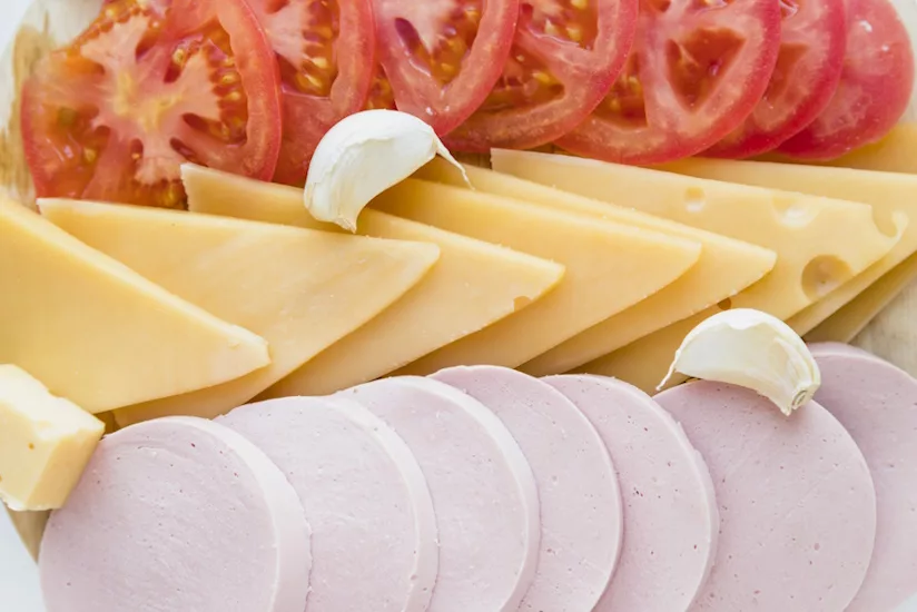 Image of cheese, tomatoes, and lunchmeat