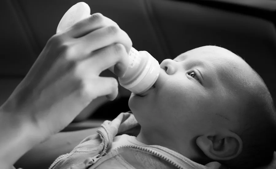 Image of baby being fed infant formula
