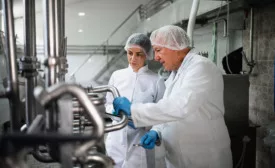 two people training in food factory