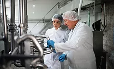 two people training in food factory
