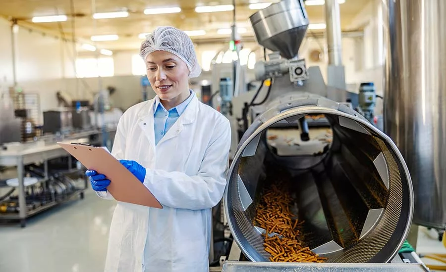 person on clipboard in processing environment_Organic MediaE+ via Getty Images.jpg person on clipboard in processing environment