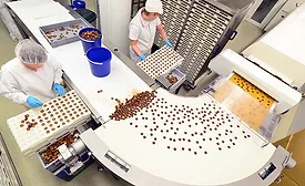 people working on chocolate production line