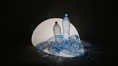 plastic water bottles under spotlight