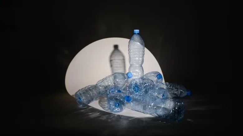 plastic water bottles under spotlight