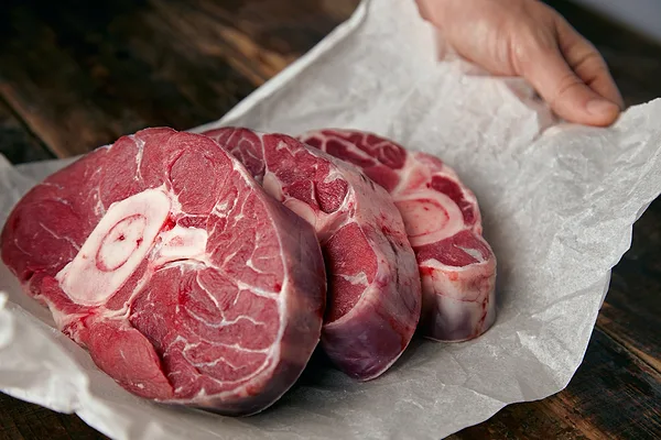 Beef shanks in paper wrapping
