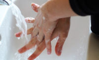 person washing hands, handwashing, sanitation