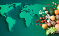 world map and fruits and veggies