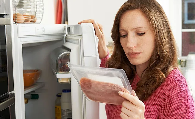 woman holding packaged food woman holding packaged food