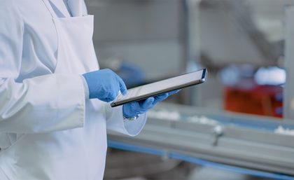 food safety professional using an ipad