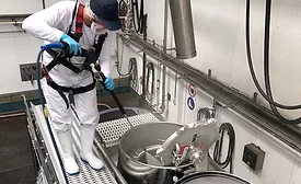 man washing equipment