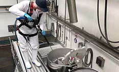 man washing equipment