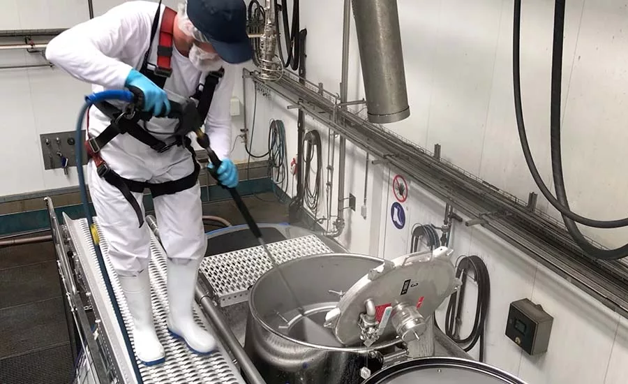 man washing equipment