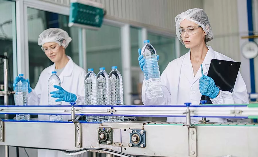 women sorting through bottles
