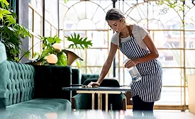 woman cleaning restaurant table