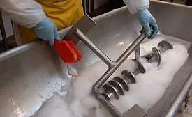 man washing equipment