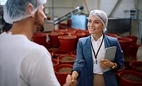 a stock photo that represents a business agreement or partnership in a food processing or production facility a stock photo that represents a business agreement or partnership in a food processing or production facility