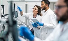 two scientists using a real-time laboratory data monitoring system two scientists using a real-time laboratory data monitoring system