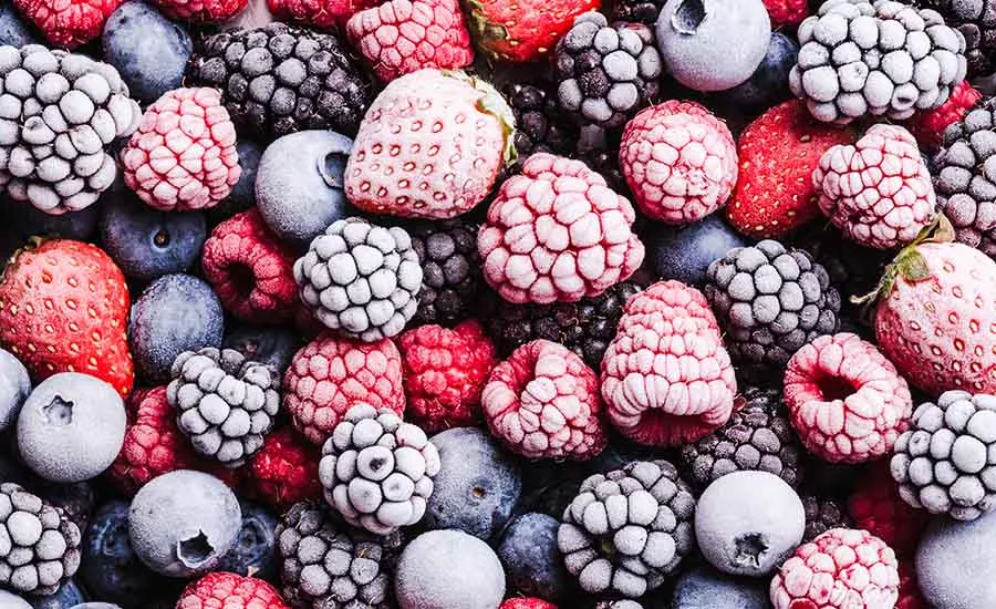 The image shows a variety of frozen berries