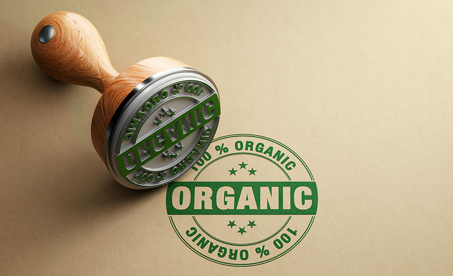 The image displays a rubber stamp and a stamped impression for an Organic certification label