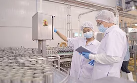 This image depicts a food production line setting