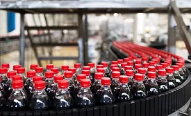 The image displays a bottling plant production line, commonly used in the beverage industry for filling and packaging soft drinks. 