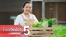 a person holding a wooden box containing various types of produce a person holding a wooden box containing various types of produce