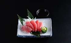 a plate of tuna sashimi, featuring sliced raw fatty tuna