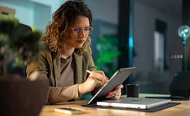 a person using a tablet computer in a professional setting
