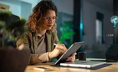 a person using a tablet computer in a professional setting