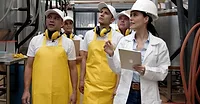 a team of operators and a manager in a food production facility