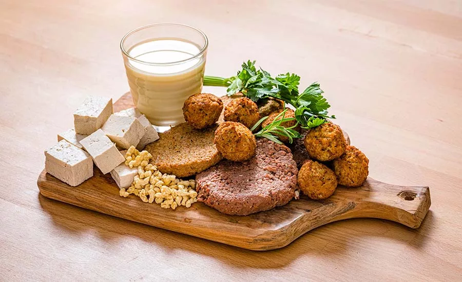 This image features a variety of plant-based meat alternative products, including tofu, plant-based milk, and veggie patties or meatballs. This image features a variety of plant-based meat alternative products, including tofu, plant-based milk, and veggie patties or meatballs.