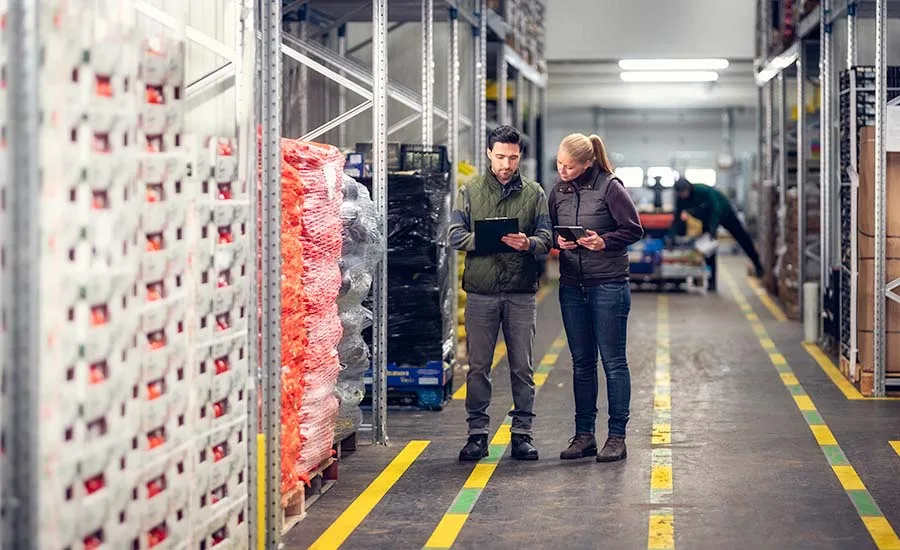 Warehouse workers taking inventory