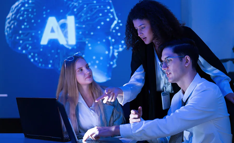 hree people collaborating in front of a laptop with an "AI" brain graphic in the background.