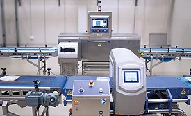 a conveyorized industrial metal detector system that appears to resemble a Loma Systems IQ4 Metal Detector setup with an integrated conveyor belt and control panel for food or package inspection.