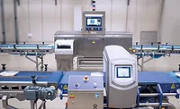 a conveyorized industrial metal detector system that appears to resemble a Loma Systems IQ4 Metal Detector setup with an integrated conveyor belt and control panel for food or package inspection. a conveyorized industrial metal detector system that appears to resemble a Loma Systems IQ4 Metal Detector setup with an integrated conveyor belt and control panel for food or package inspection.
