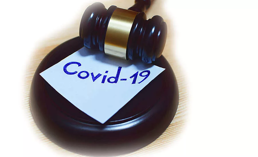 gavel with Covid-19 on a sticky note