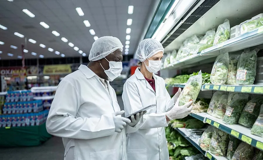 Inspectors analyzing FDA-regulated foods in supermarket