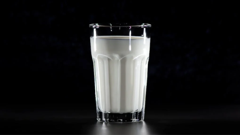 8218 glass of milk black background.png