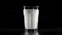 glass of milk, black background