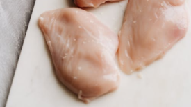 chicken breasts on a cutting board