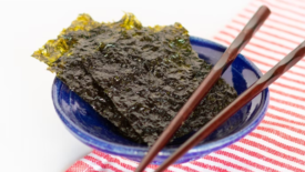 dried edible seaweed with chopsticks