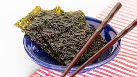dried edible seaweed with chopsticks