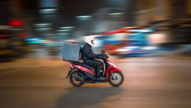 man delivering food on motorcycle