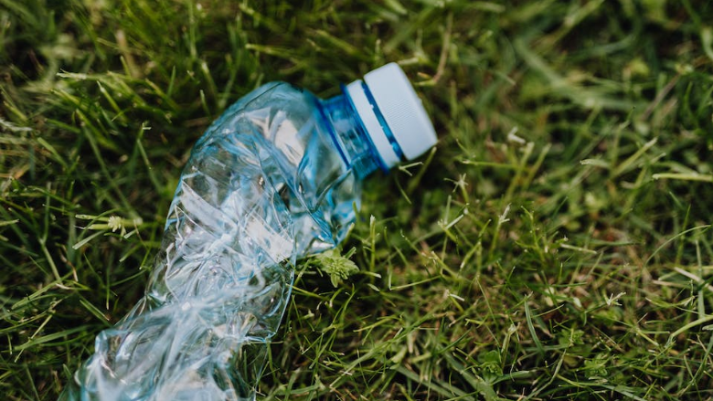 plastic water bottle on grass