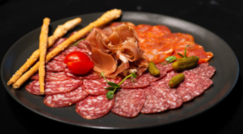assorted cured meats on a plate