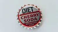 bottle cap that says "diet cherry soda: artificial sweetener and flavoring"