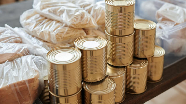 cans and bread packaged for donation.png
